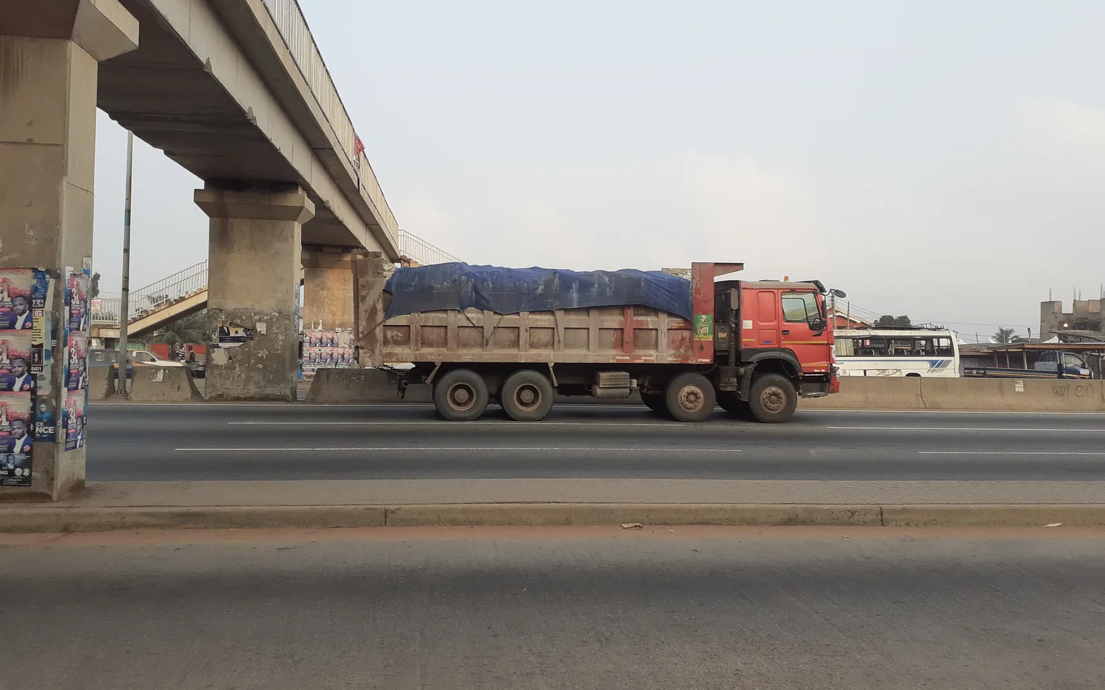 Tipper truck transporting construction aggregate for infrastructure works