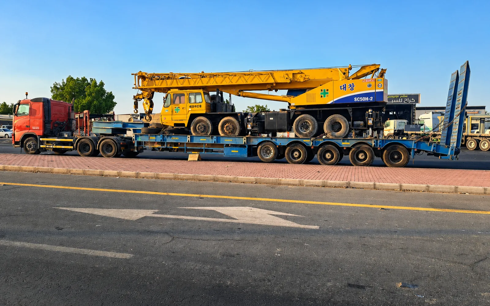 Mobile crane transported on a multi-axle heavy-haul trailer as part of a UAE project logistics fleet