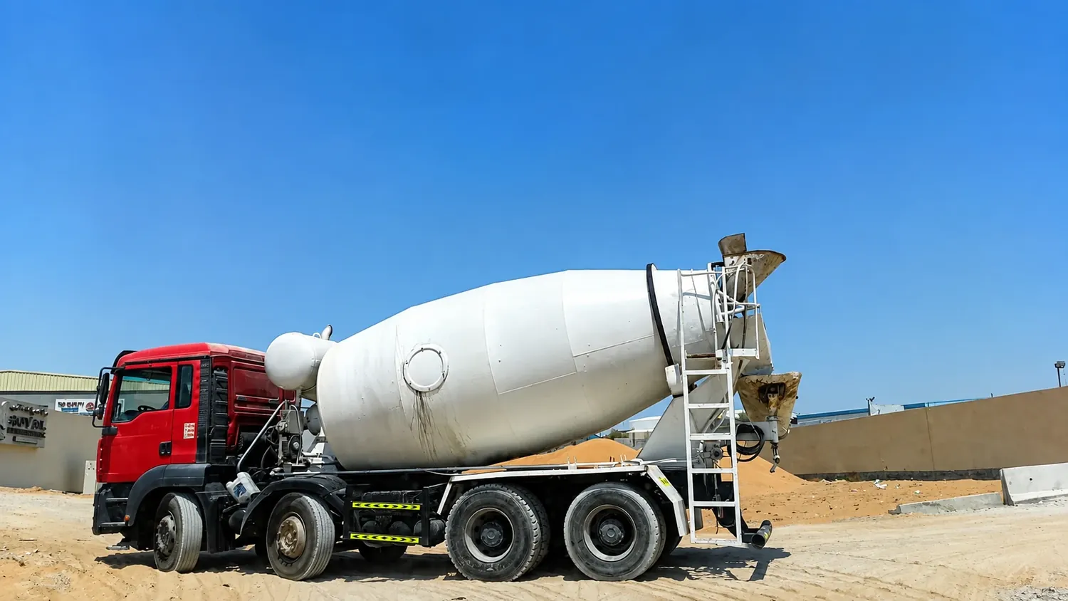 Ready-mix concrete mixer truck supporting construction material delivery at a UAE project site
