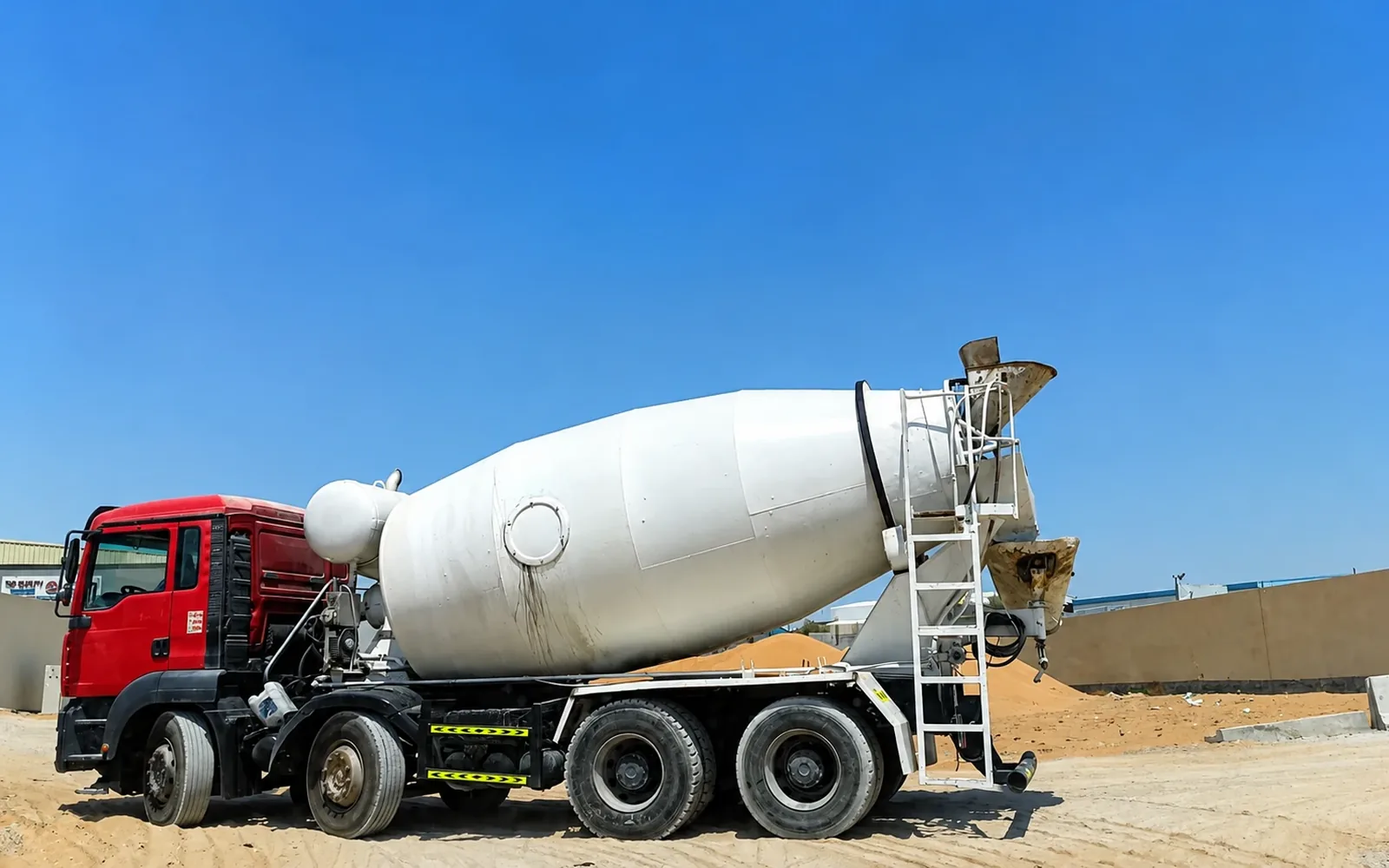Ready-mix concrete mixer truck supporting construction-material delivery at a UAE project site