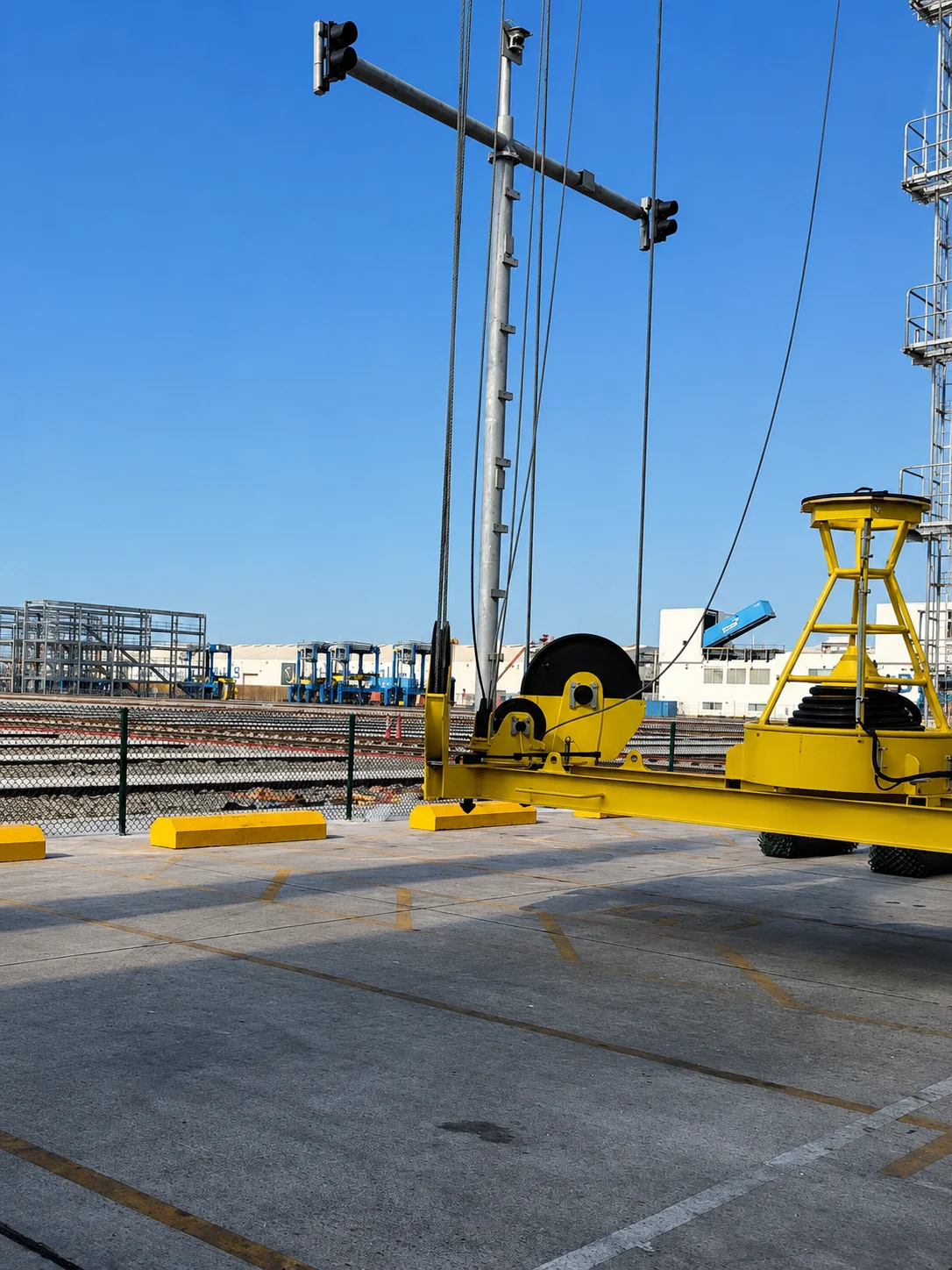 Concrete wheel stoppers installed in an industrial rail-yard vehicle area in the UAE