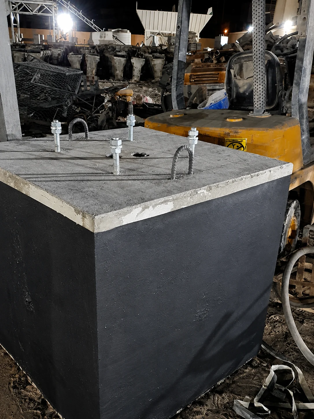 Precast concrete anchor-bolt foundation produced during a night shift in a UAE factory